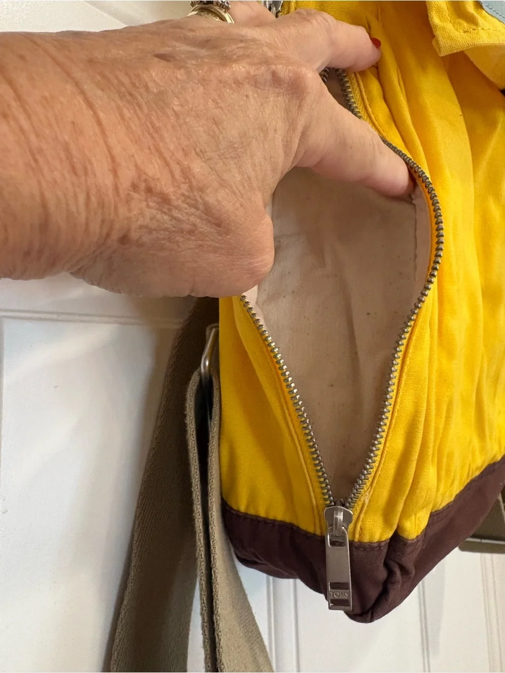 TOMS Citrus Waxed Canvas Trekker Backpack with Brown Base and Roll-Top Closure